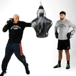 two men on punching the bag other watching